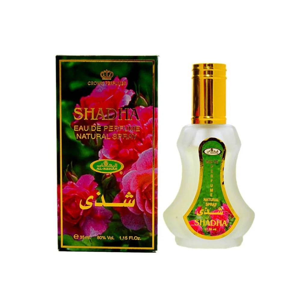 Al-Rehab Parfum Shadha in glazen fles met goudkleurige dop en bloemrijke verpakking