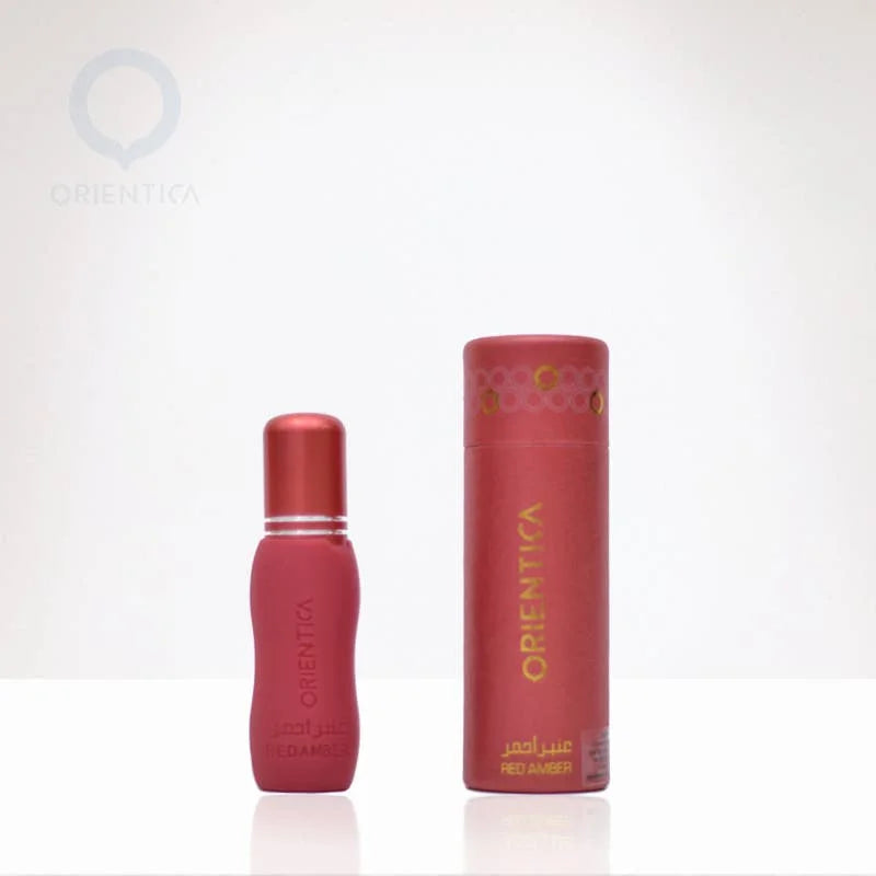 Twee rode parfumflesjes van Orientica Rood Amber 6ml, één met dop en in doosje